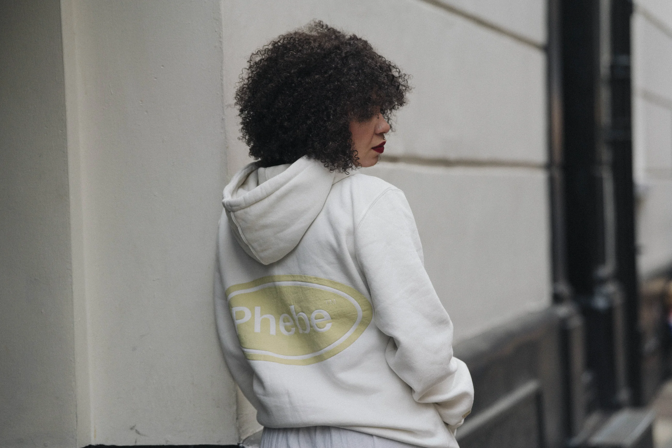 Portrait of Isabela Santos in a Phebe Industry hoodie